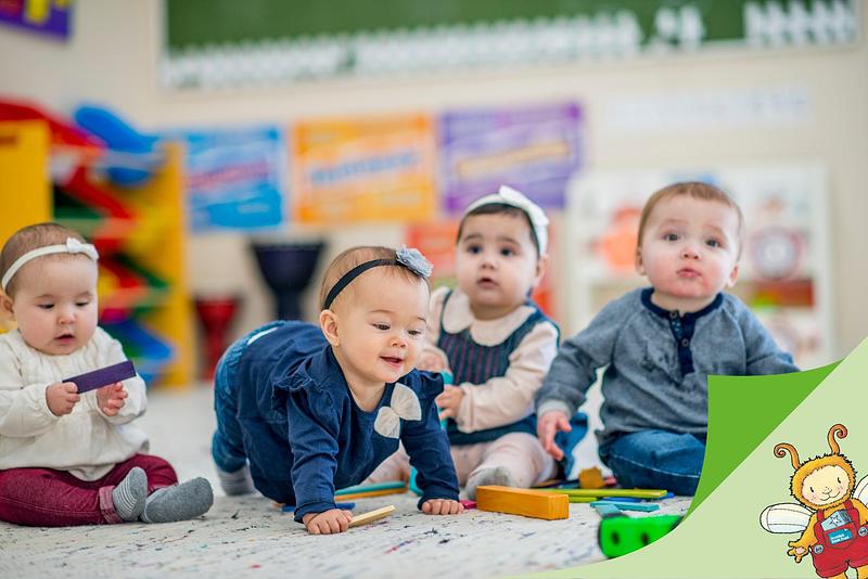 Decorative image: babies playing with wooden toys with the Bookbug logo in the bottom right-hand corner